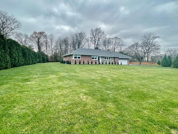 FRONT OF HOUSE SHOWING PRIVATE SIDE YARD