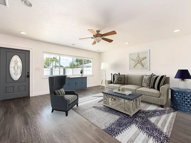 Large light and bright living room with GAINT window!