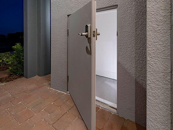 Sims Trinity Package Place outdoor storage area with secure delivery door and electronic keypad door