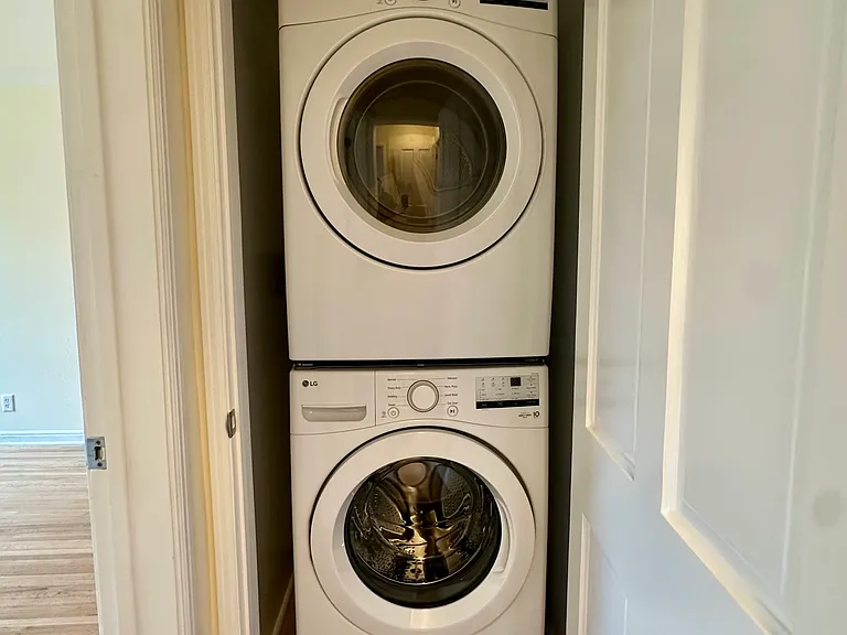 Brand new LG washer + dryer, tucked away in the closet with a closed door so it's hidden