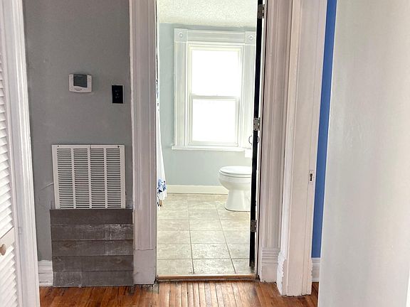 View from Living room into hall and bath