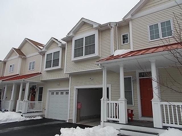 Front includes porch and attached garage