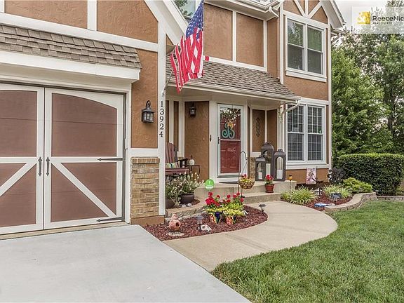 Cute front porch and gorgeous landscaping!
