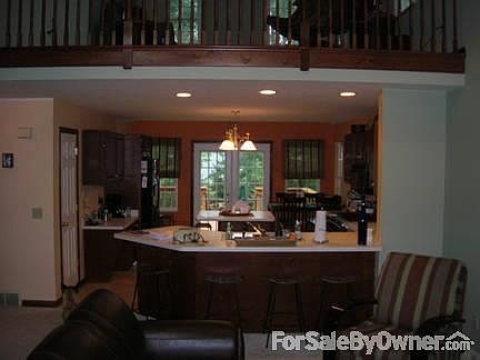 Kitchen
						:
						Open floor plan is good for socializing while you cook. Doors open to back deck.