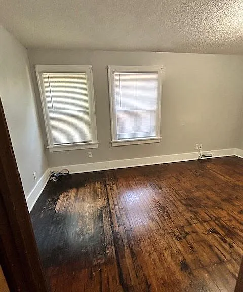Main living area. 2 south facing windows that still let in natural light.