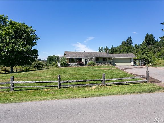 Home has master on the main, sun room, and over-sized two car garage.