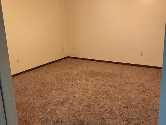 Very large living room (approx 13feet x 16feet) with newer carpet.