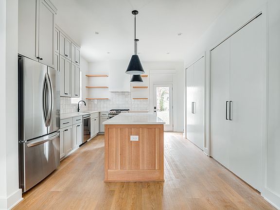 Large kitchen with island, pantry & storage