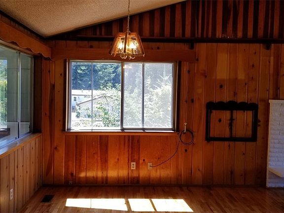 Dining room, adjacent to living room has windows on 2 sides allowing lots of natural lighting.