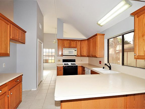 The kitchen offers a gas freestanding range, dishwasher and microwave. Also a large window overlooking the backyard. Tile flooring make for easy cleaning.