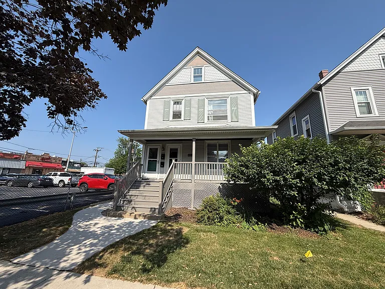 Front of property, parking lot adjacent