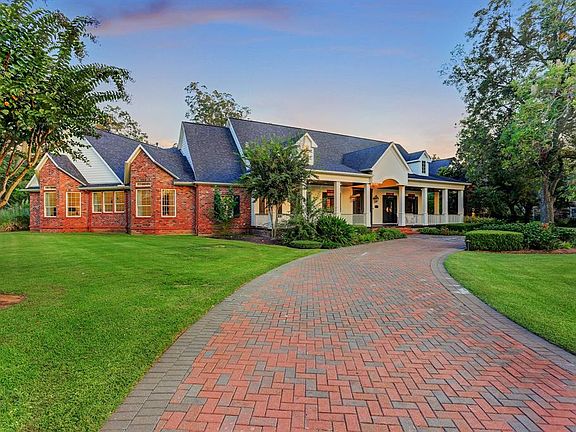 Taken at dusk, this photo showcases the recent addition and expansive front porch.