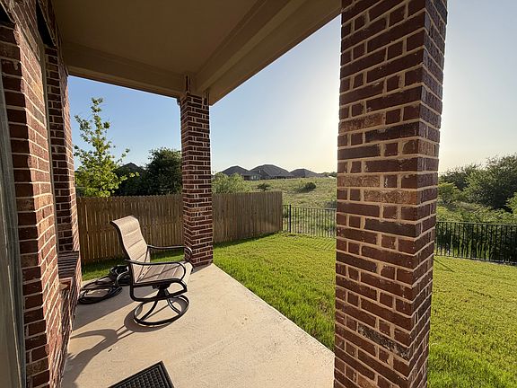 Left side view of back patio overlooking greenbelt line