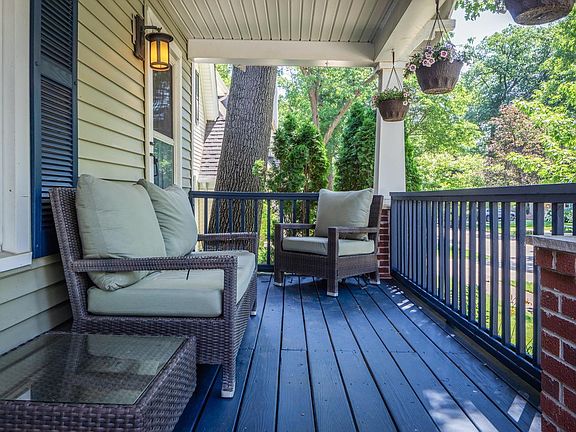 Comfortable front porch to enjoy the outdoor weather from a covered space.