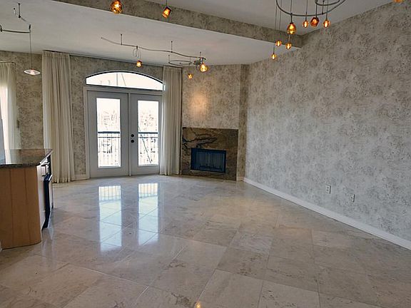 Beautiful tiled floors and great space with contemporary lighting and views to the marina.