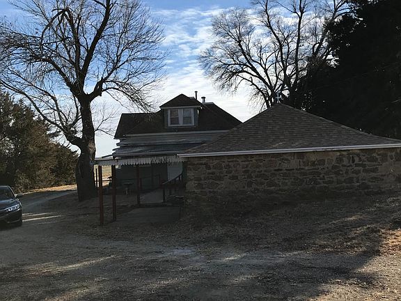 Back of home and small detached garage