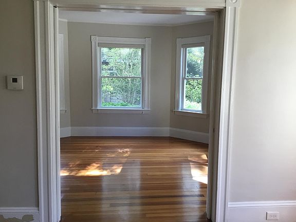 Another view of the living room - there are four windows, lots of light!