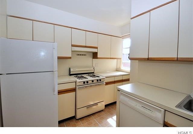 Updated kitchen has plenty of cabinets and counter space.  Appliances include a dishwasher, range and refrigerator.
