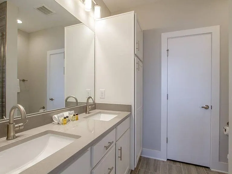 double vanity master bath, an additional closet connected