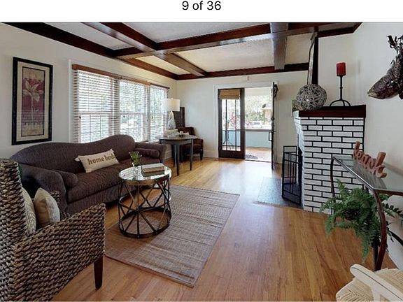 Welcoming family room with wood burning fireplace and large wall for your large flatscreen TV