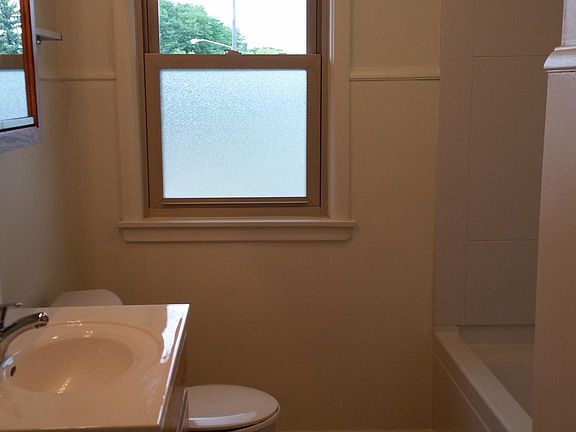 Bathroom - Tub/Shower, toilet, single vanity, and even a laundry shoot to the basement.