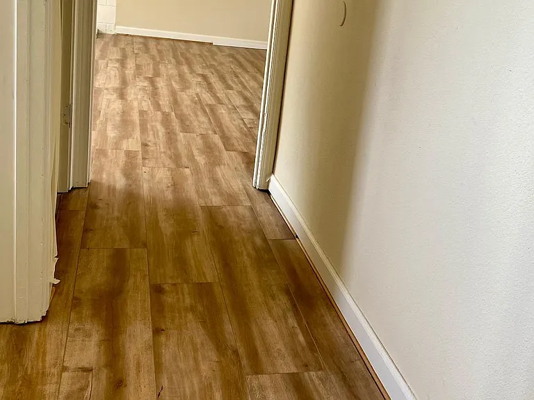 Hallway downstairs leading to family room