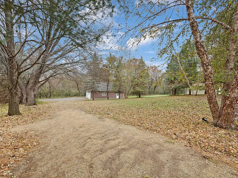 Veiw of expansive backyard with regular wildlife visitor such as wild turkeys and deer.