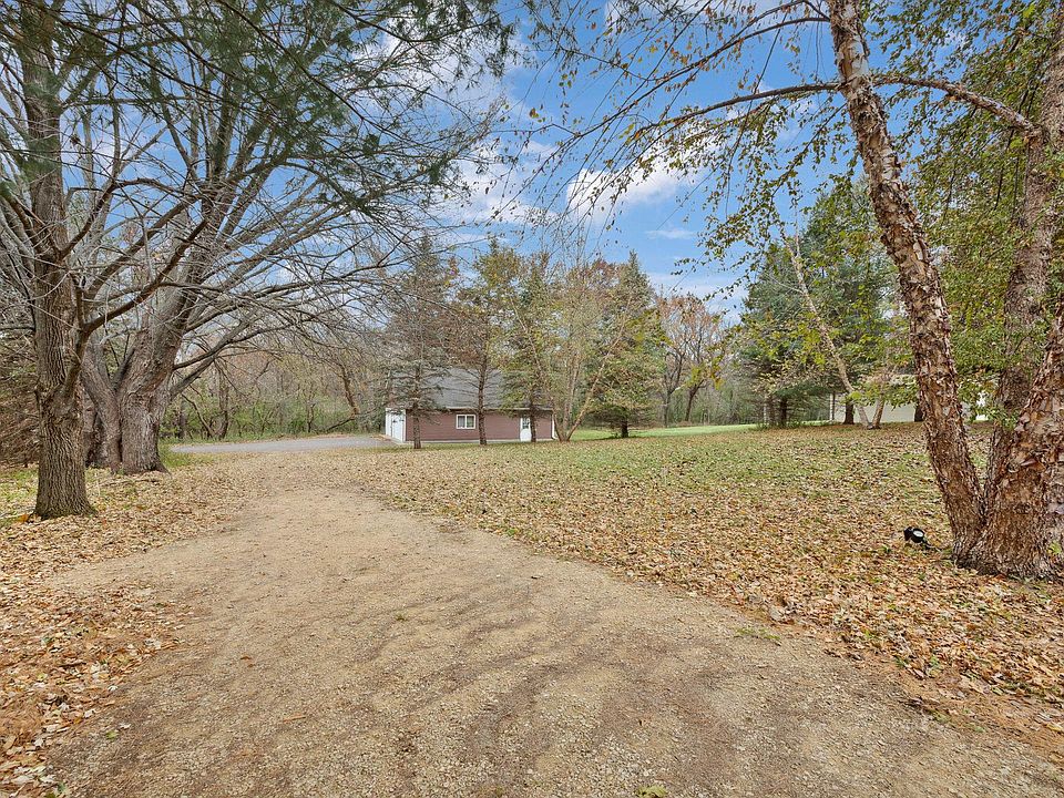 Veiw of expansive backyard with regular wildlife visitor such as wild turkeys and deer.