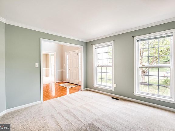 Formal living room with lots of natural light
