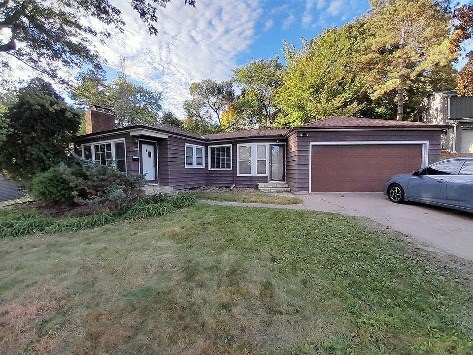 Front of house showing Garage and many windows