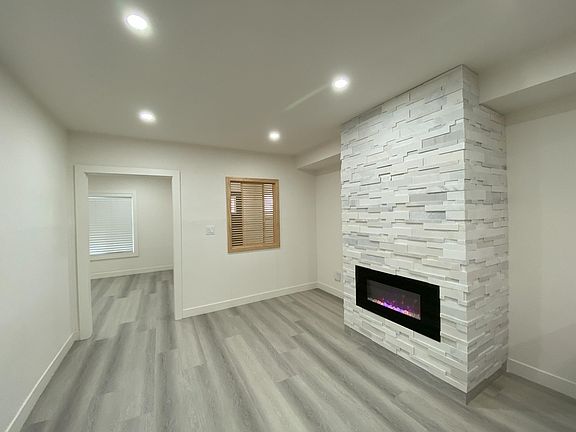 The Family Room/Dining Room has a faux fireplace. It's between the Living Room and the Kitchen.