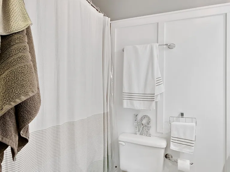 Full bathroom with tub/shower combination and functional layout.