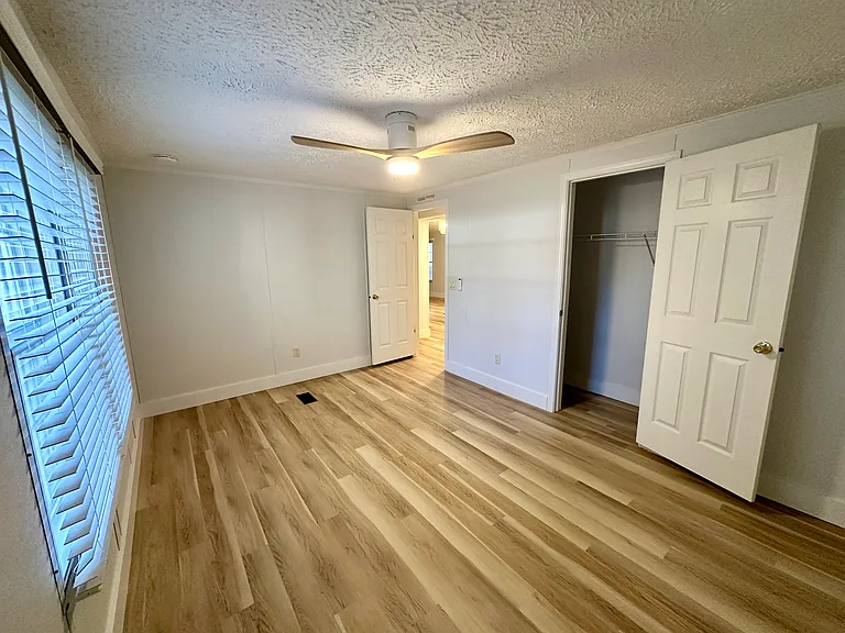 One of the secondary bedrooms with a closet, or could make a great office