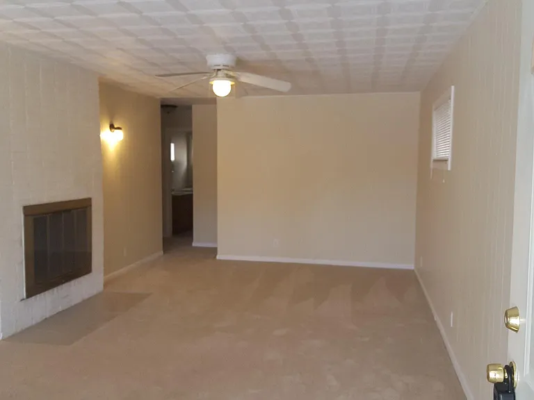 Very large living room with wood burning fireplace from front door