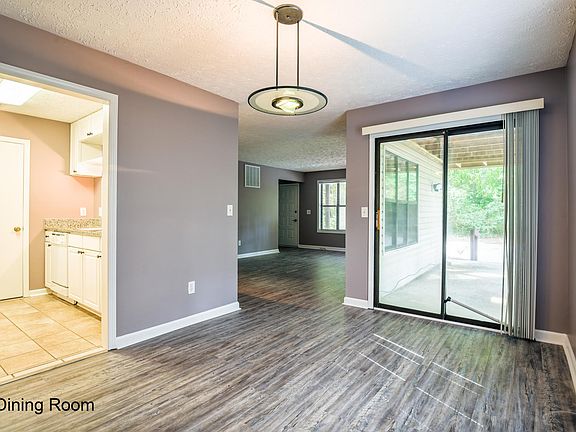 The dining room gives you views to the kitchen and private outdoor patio.