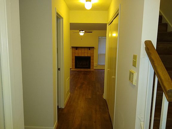 Entry hallway; dining room, kitchen, half bath on left; family room ahead, laundry and stairs to the right