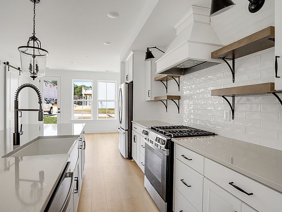 Kitchen featuring floating shelves