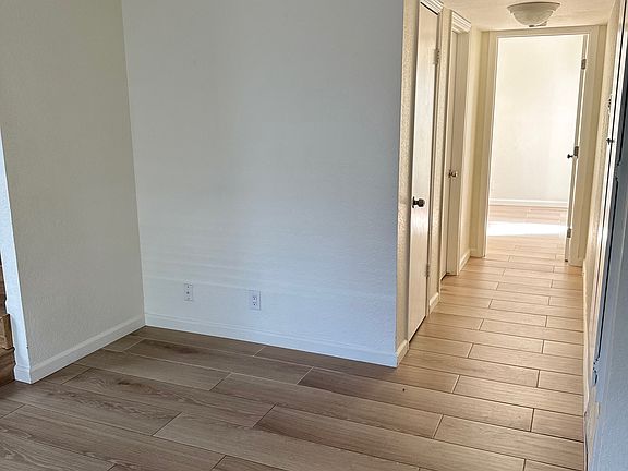 Hallway to restroom and downstairs bedroom