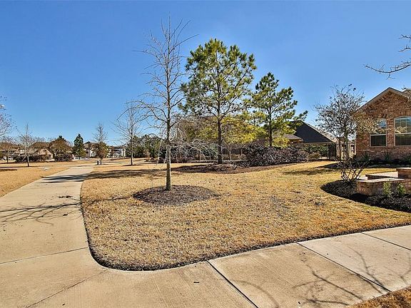 The cul de sac location affords you a nice, private side yard, a pool-sized backyard and great access to the walking trails!