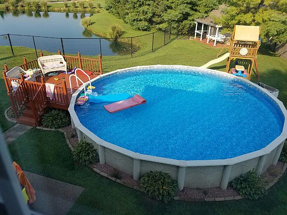 Pool, deck, lake, back yard