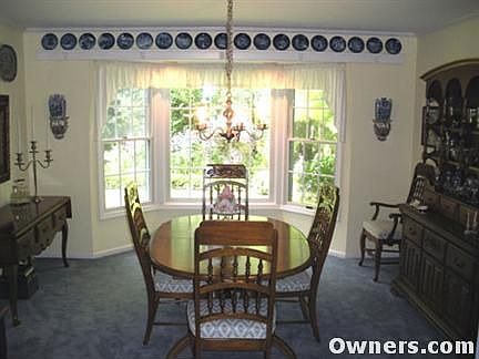 Large dining room with a bay window.