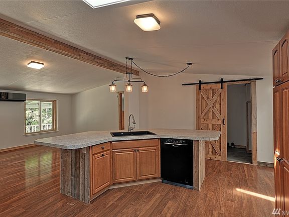 Bright, open space.  Barn doors into laundry room.