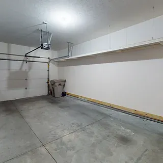 Over size Single Car Garage with overhead storage.