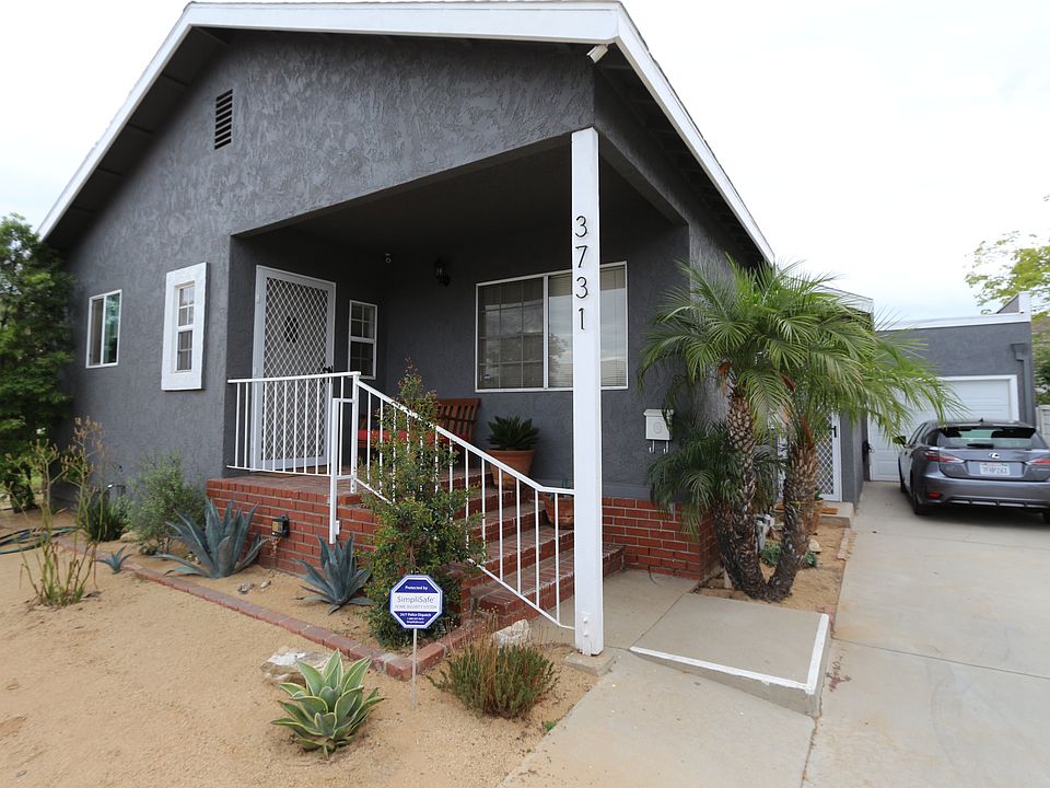 Entry to the duplex is in the front. The driveway fits two v