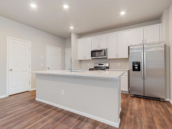 The open-concept kitchen spills into the dining room allowing for an open feel.