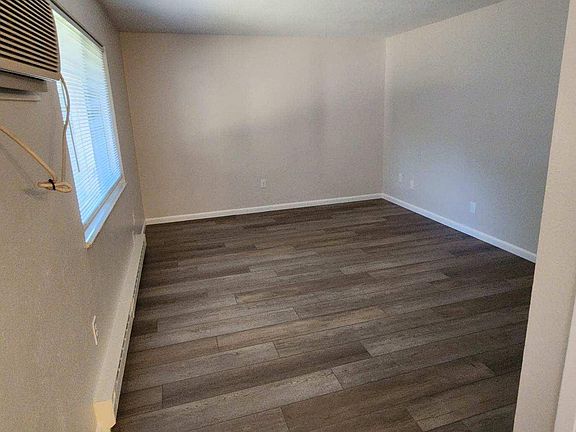 Faux wood floor & fresh paint in living room.