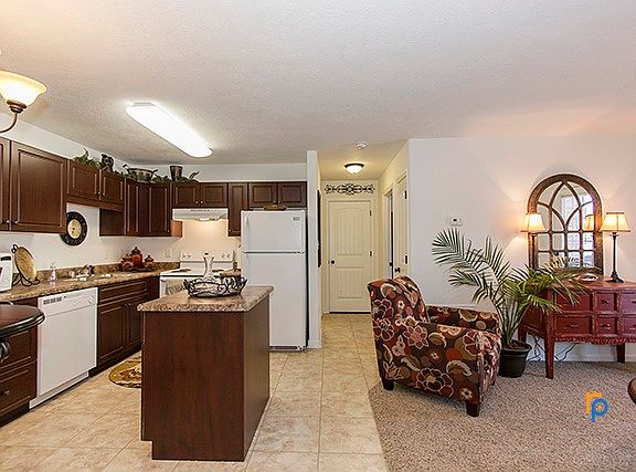 Cherry red color cabinets and a floating kitchen island!