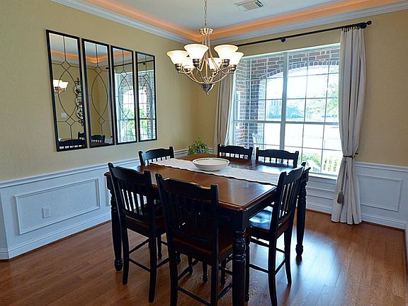 This beautiful Dining Room has been updated with picture molding, rope/molding light and the chandel