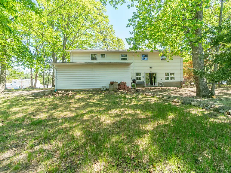 large backyard, total property size of 1 acre