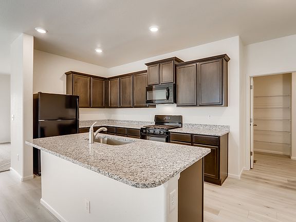 The spacious kitchen is perfect for preparing your family s favorite meals and treats.